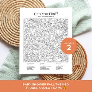 May include: A black and white baby shower search game with fall-themed illustrations. The game includes a list of objects to find within the detailed drawing. The words "Can You Find?" and "Baby Shower Search" are at the top. The game is on a white background.
