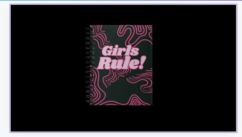 May include: A black spiral notebook with a pink and black abstract design. The text "Girls Rule!" is printed in pink on the front cover.
