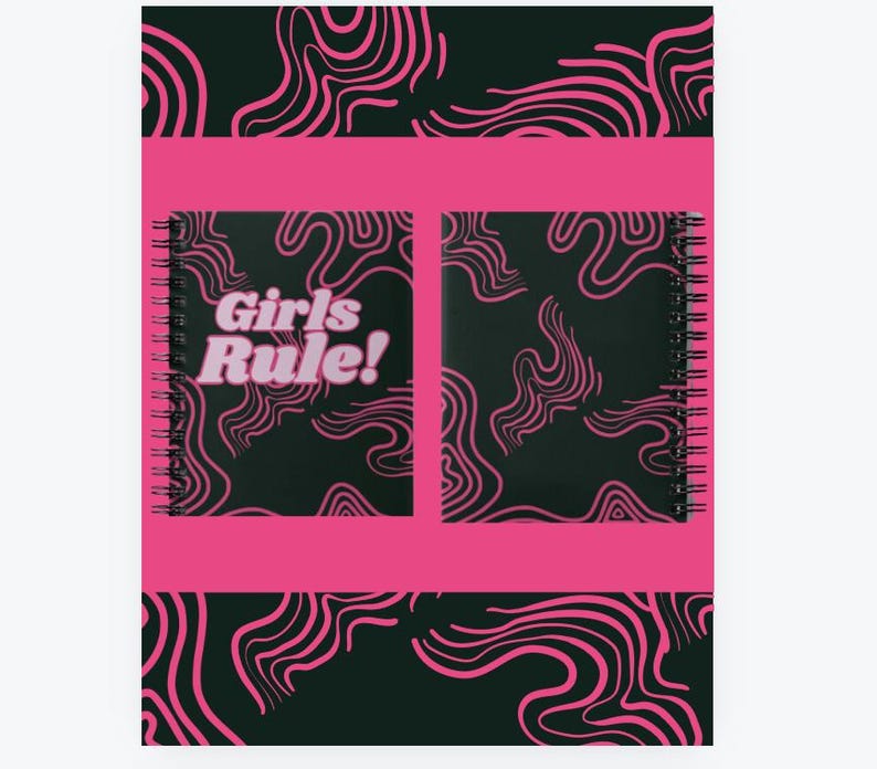 May include: A pink and black spiral notebook with a black and white swirl pattern on the cover. The front cover has a pink rectangle with the text "Girls Rule!" in white.