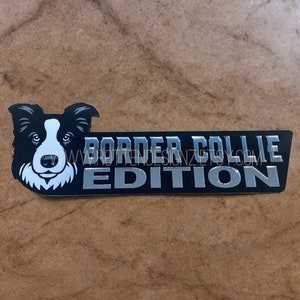 May include: Silver and black sticker with a border collie dog head and the text "BORDER COLLIE EDITION".