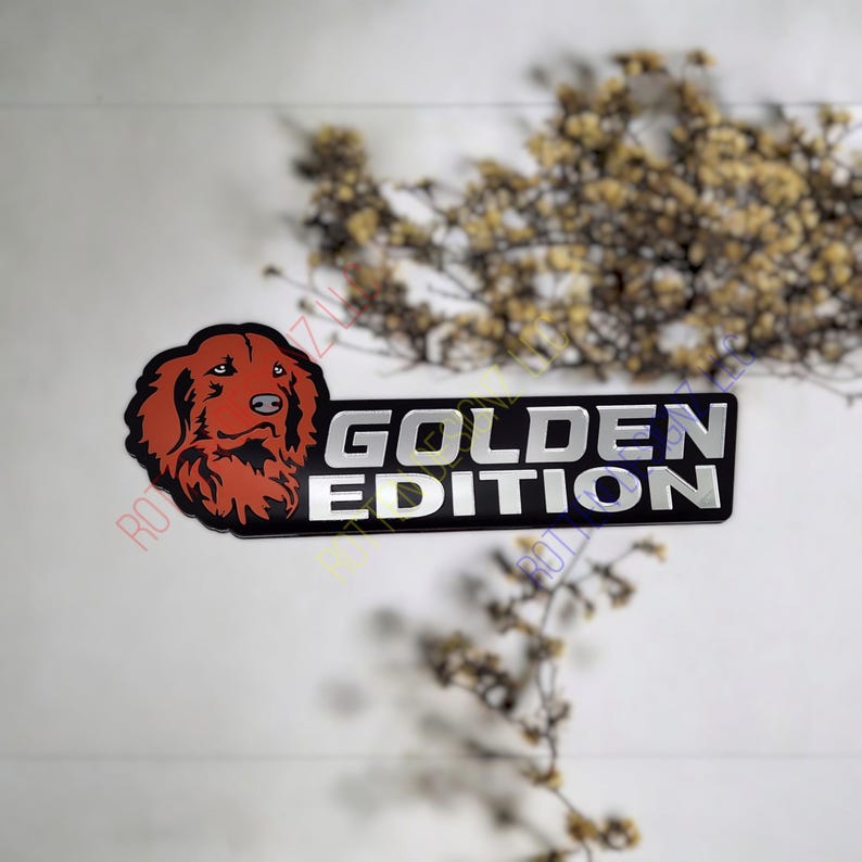 May include: A black and silver sticker with a red dog head and the text "GOLDEN EDITION".