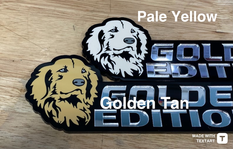 May include: Two black and silver car emblems with a golden retriever dog silhouette. The top emblem has a white dog and the text "GOLDEN EDITION". The bottom emblem has a tan dog and the text "GOLDEN EDITION".