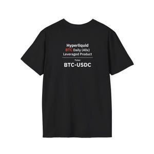 May include: A black short-sleeved t-shirt featuring white and red text on the chest that reads: Hyperliquid, BTC Daily (40x), Leveraged Product, Ticker, BTC-USDC. The shirt has a crew neckline and a standard fit, displaying clear financial branding.