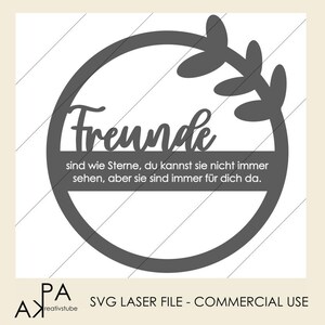 May include: A grey circle with a leafy design around the edge. The text "Freunde sind wie Sterne, du kannst sie nicht immer sehen, aber sie sind immer für dich da." is inside the circle.