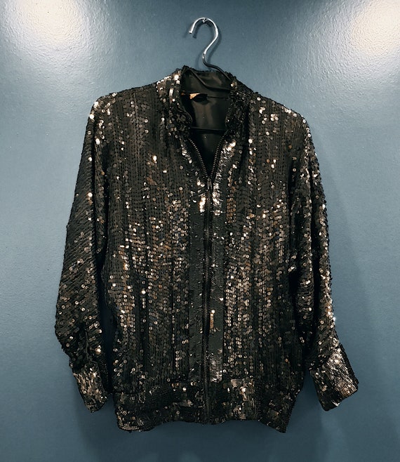 Black sequined silk bomber jacket.