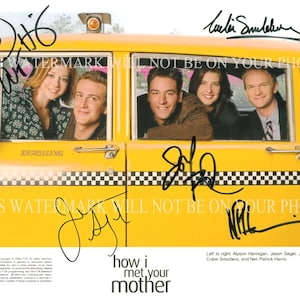 May include: A yellow taxi cab with five cast members from the television show "How I Met Your Mother" inside. The cast members are Alyson Hannigan, Jason Segel, Josh Radnor, Cobie Smulders, and Neil Patrick Harris. Each cast member has signed their name on the photo.