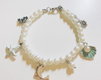 Dolphin themed pearl charm bracelet