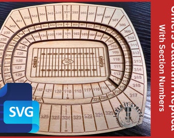 May include: A wooden replica of Arrowhead Stadium, home of the Kansas City Chiefs, with all the section numbers engraved. The field is also engraved with the Chiefs logo and the word "Chiefs" on each side of the field.