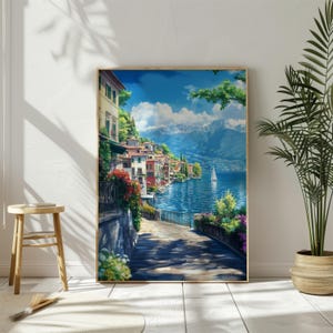 Peut inclure: Une peinture représentant un village italien coloré niché au bord d'un lac, avec des montagnes enneigées en arrière-plan. Un voilier navigue sur les eaux bleues. La scène est encadrée par un cadre en bois.