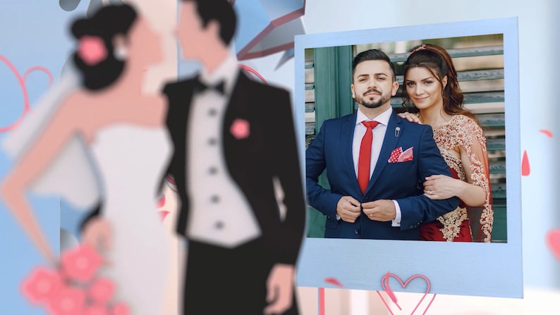 May include: A wedding photo of a couple in formal attire. The groom is wearing a blue suit with a red tie and a white pocket square. The bride is wearing a red dress with gold embroidery. The photo is framed in a blue and white border.