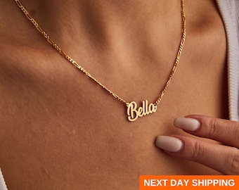 May include: A gold chain necklace with a cursive name pendant that says "Bella".