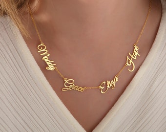 May include: Gold necklace with four names, "Maddy", "Grace", "Eliza", and "Hope", spelled out in cursive.