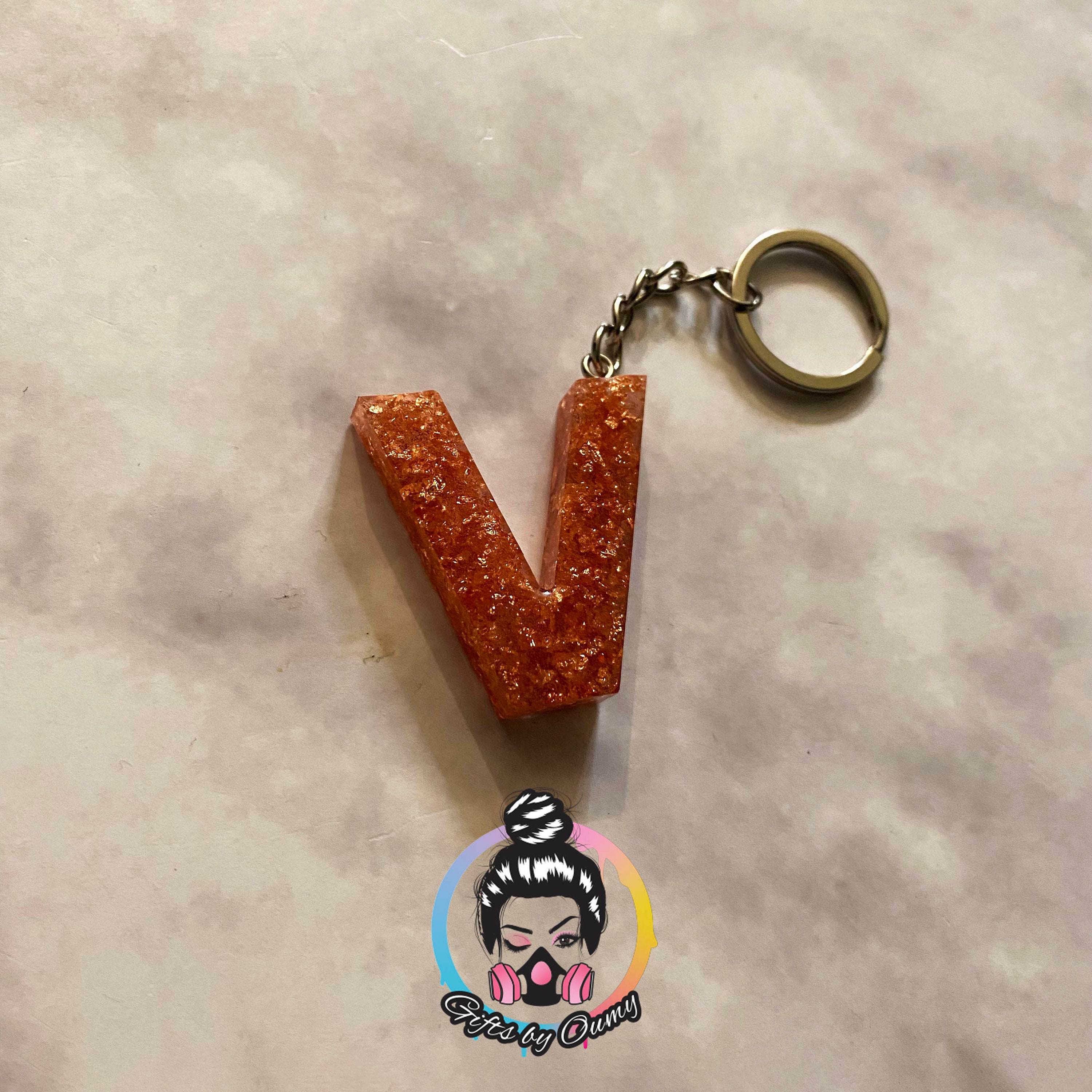 V name shop keychain