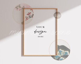 Può includere: Una scena di mockup minimalista con un poster incorniciato in legno con il testo "YOUR DESIGN HERE" e uno sfondo bianco. Il poster è circondato da tre motivi circolari con disegni floreali e geometrici.