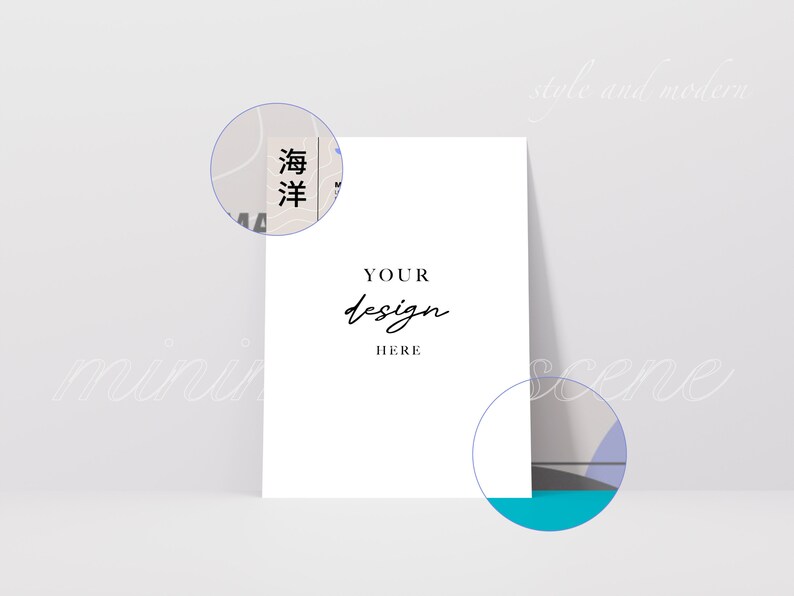 May include: A white card mockup with the text "YOUR design HERE" in black script font. The card is sitting on a light gray surface with a blue, gray, and white abstract design in the background.