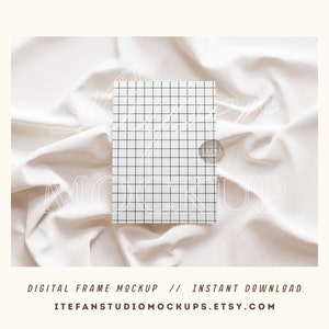 May include: A digital frame mockup featuring a white background with a grid pattern. The frame is on a white fabric with folds. The text "Digital Frame Mockup // Instant Download" is at the bottom of the image.