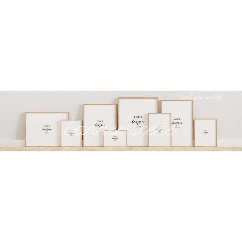 May include: A set of eight wood framed picture frames in various sizes, all with white mats and a white background. The frames are arranged in a row on a light wood surface. The text "Your design here" is written in black on each frame.