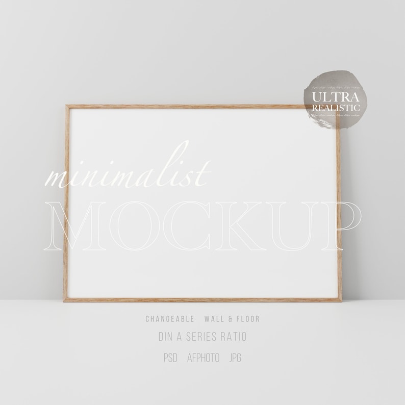 Puede incluir: Una maqueta minimalista con un marco de madera y un fondo blanco. El texto "minimalist MOCKUP" est&aacute; escrito en blanco en el marco. El texto "CHANGEABLE WALL & FLOOR DIN A SERIES RATIO PSD AFPHOTO JPG" est&aacute; escrito en negro en la parte inferior de la imagen.