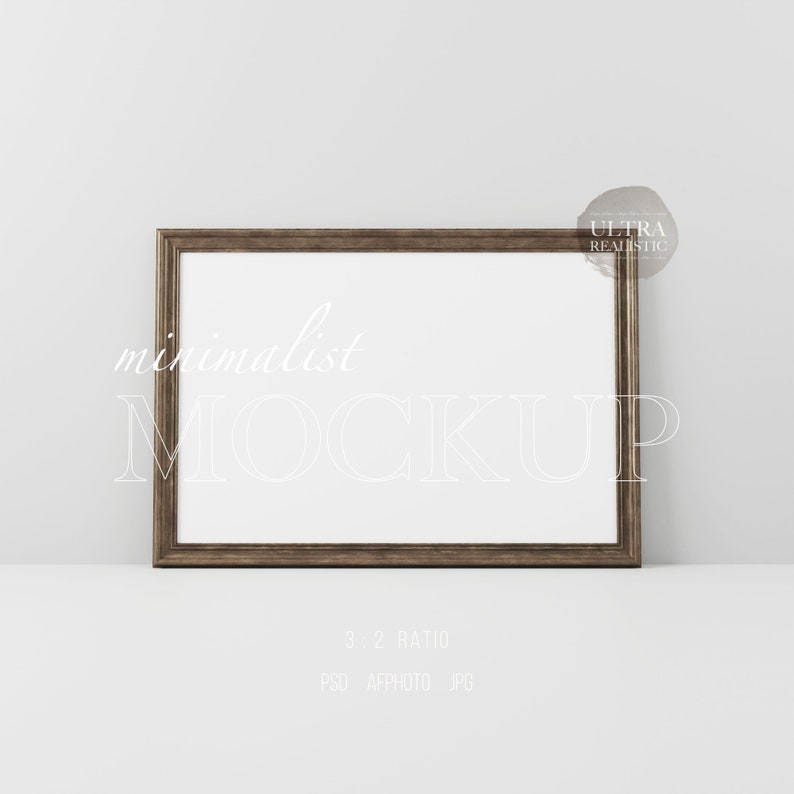 May include: A brown wood frame with a white mat and a white background. The frame is sitting on a white surface. The text "minimalist MOCKUP" is written in white on the frame. The text "3:2 RATIO" is written in white below the frame. The text "PSD AFFPHOTO JPG" is written in white below the ratio text.