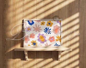 May include: A framed floral art print featuring a colorful pattern of stylized flowers in shades of blue, yellow, pink, and purple. The print is displayed on a wooden shelf against a wood-paneled wall. The text "Preview" is written on the image.