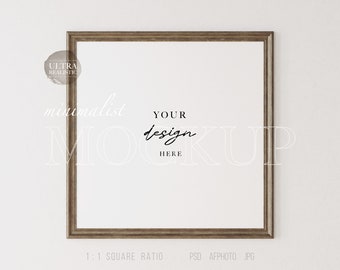 May include: A brown wood frame with a white mount and a white background. The frame is hanging on a white wall. The text "minimalist mockup" and "YOUR design HERE" is written on the frame. The text "1:1 SQUARE RATIO PSD AFPHOTO JPG CHANGEABLE WALL" is written below the frame.