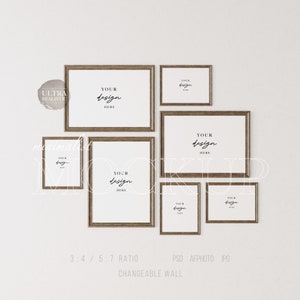 May include: A wall gallery mockup with six wooden picture frames of various sizes. The frames are arranged in a staggered pattern and feature the text "YOUR design HERE" in each frame.