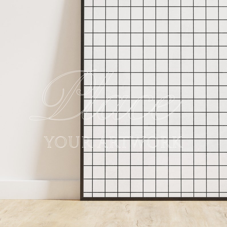 K&ouml;nnte beinhalten: Eine schwarze gerahmte Leinwand mit einem wei&szlig;en Gittermuster. Die Leinwand lehnt an einer wei&szlig;en Wand. Der Text "Place Your Artwork" ist in Wei&szlig; auf der Leinwand geschrieben.