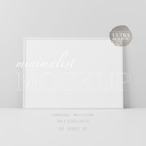 May include: White frame mockup with the text "minimalist MOCKUP" in white on a white background. The text "CHANGEABLE WALL & FLOOR" is below the frame. The text "DIN A SERIES RATIO" is below that. The text "PSD AFPHOTO JPG" is below that.