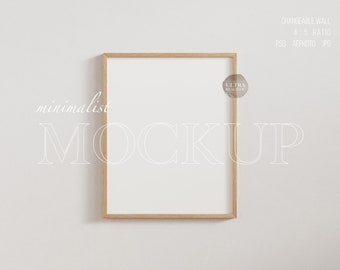 May include: A minimalist mockup featuring a wood framed picture on a white wall. The frame is empty and ready for your design.