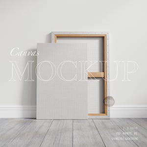 May include: A white canvas mockup with a wooden frame, leaning against a white wall. The canvas is blank and ready for your design. The text "Canvas Mockup" is written in white on a gray background.