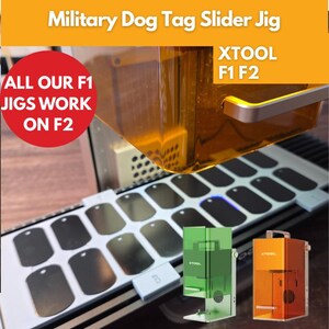 May include: A military dog tag slider jig with the text "Military Dog Tag Slider Jig" and "XTOOL F1 F2". The image shows a jig with multiple dog tags, and the text "ALL OUR F1 JIGS WORK ON F2". There are also two small colored machines.