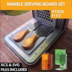 May include: A marble serving board set with two cheese knives featuring wooden handles and stainless steel blades. The set includes a laser engraving machine and the text "XCS & SVG FILES INCLUDED".