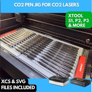 May include: A CO2 pen jig for CO2 lasers, featuring multiple pens arranged in rows. The image includes the text "CO2 PEN JIG FOR CO2 LASERS", "XTOOL S1, P2, P3 & MORE", and "XCS & SVG FILES INCLUDED".