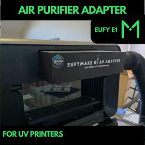 May include: A black 3D printer with a black and grey air purifier adapter attached to the top. The adapter has a label that reads "EUFYMAKE E1 AP ADAPTER CREATIVE 3D Engravinga". The printer is labelled "EUFY E1".