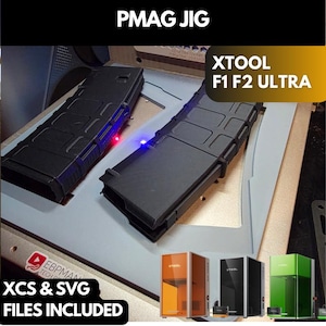 May include: A PMAG JIG for XTOOL F1 F2 ULTRA laser machines. The light gray jig holds two black magazines in place. Text on the image includes PMAG JIG, XTOOL F1 F2 ULTRA, and XCS & SVG FILES INCLUDED. Small orange, black, and green laser machines are shown.