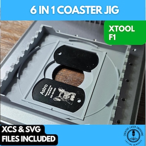 May include: A gray 6 in 1 coaster jig with a black metal coaster blank inside. The jig is labeled "XTOOL F1" and includes XCS and SVG files.