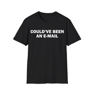 May include: Black t-shirt with the white text "COULD'VE BEEN AN E-MAIL" across the chest. The short-sleeved shirt is made of a soft material and is suitable for casual wear.