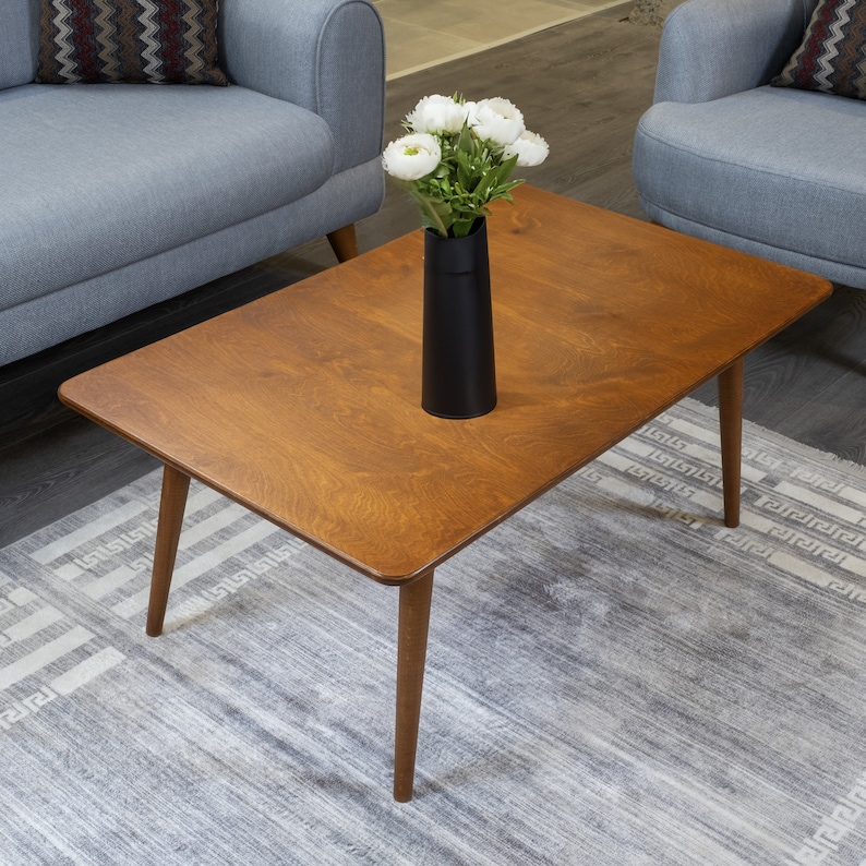 Discover the Modern Oval Coffee Table for your home! This versatile walnut coffee table, made from pine wood, fits seamlessly with any living room furniture.