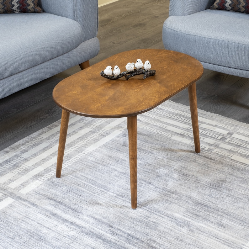 Here's small oval coffee table walnut wood! This coffee tables for small space will be perfect matches with your sofa or livingroom furnitures. Mid century modern middle table and minimalist table turns to rustic atmosphere!