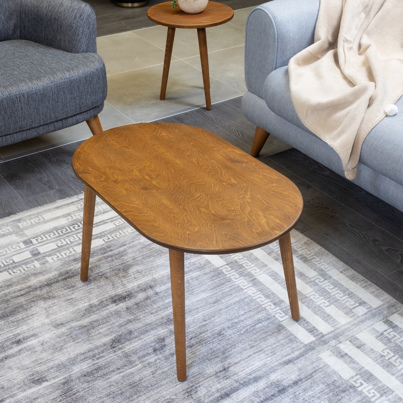 Here's small oval coffee table walnut wood! This coffee tables for small space will be perfect matches with your sofa or livingroom furnitures. Mid century modern middle table and minimalist table turns to rustic atmosphere!