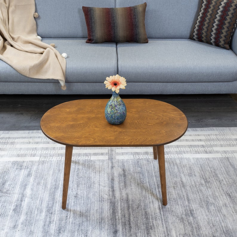 Here's small oval coffee table walnut wood! This coffee tables for small space will be perfect matches with your sofa or livingroom furnitures. Mid century modern middle table and minimalist table turns to rustic atmosphere!