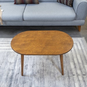 Here's small oval coffee table walnut wood! This coffee tables for small space will be perfect matches with your sofa or livingroom furnitures. Mid century modern middle table and minimalist table turns to rustic atmosphere!