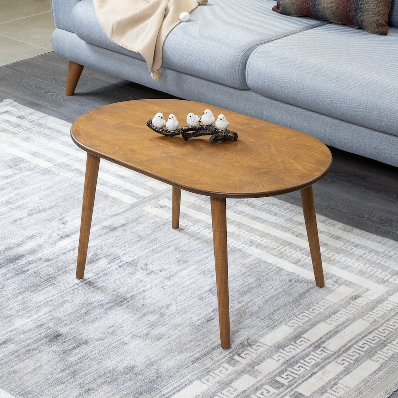 Here's small oval coffee table walnut wood! This coffee tables for small space will be perfect matches with your sofa or livingroom furnitures. Mid century modern middle table and minimalist table turns to rustic atmosphere!