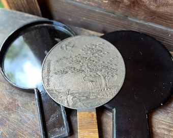 Pristine early Meiji bronze cast mirror with black lacquer box