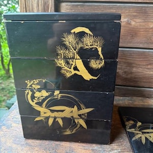 Early 1900s black lacquer jubako with pine and bamboo maki-e