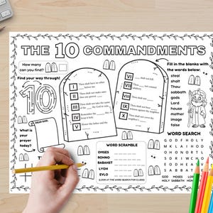 May include: Black and white coloring page with the text "THE 10 COMMANDMENTS". The page includes fill-in-the-blank sections, a word search, and a word scramble. A hand is holding a yellow pencil, ready to color.