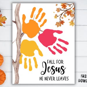 May include: A white rectangular print featuring a watercolor tree branch with orange, yellow, and pink handprint shapes. The text reads FALL FOR Jesus HE NEVER LEAVES in black lettering. The design includes small autumn leaves in the upper right corner.