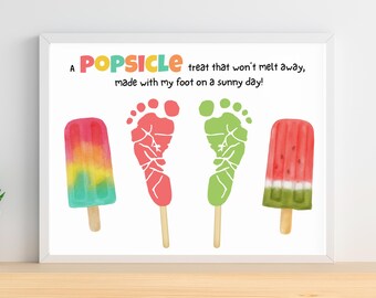 May include: A framed print featuring colorful popsicle illustrations and footprints. The text reads, "A POPSICLE treat that won't melt away, made with my foot on a sunny day!" The popsicles are red, yellow, green, and watermelon-themed.
