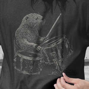 Otter Drummer Shirt - Whimsical Water Musician Tee for Drum and Animal Lovers - Playful Otter Percussionist Design