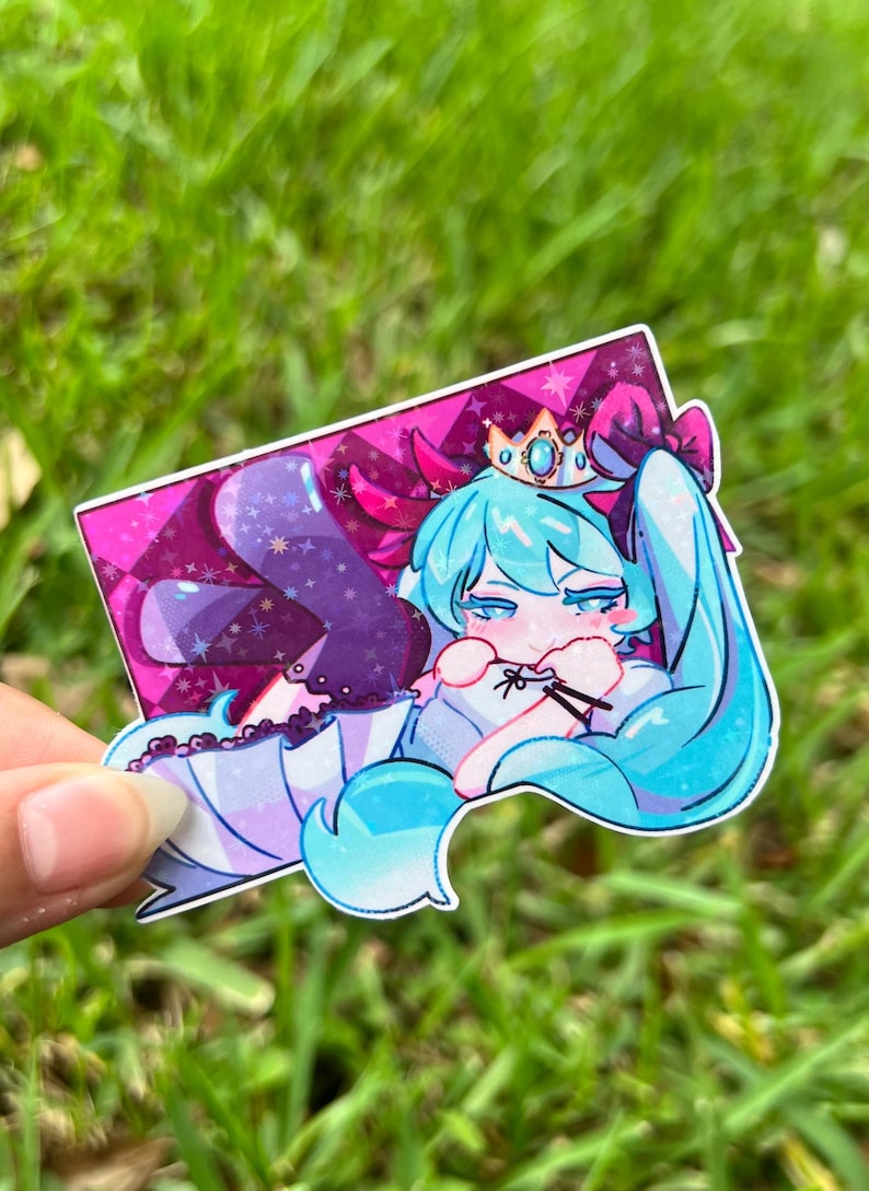 May include: A sticker featuring a cartoon character with long, light blue hair, a crown, and a bow. The character is lying down on a pink and purple background with a diamond pattern. The sticker has a white border.